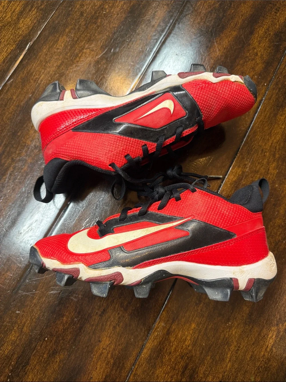 Nike Kids Red and Black Soccer Cleats with White Swoosh